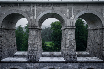 Fototapeta na wymiar Sychrov stone railway viaduct was built in 1857-1859, construction was carried out by brothers Klein and V. Lanna. In the upper part there are 8 arches with a span of 9.5 meters.