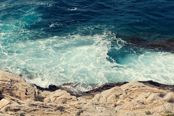 Beautiful view of a raging sea on shore Selective focus