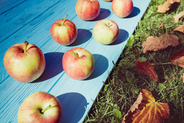 juicy apples on a wooden background