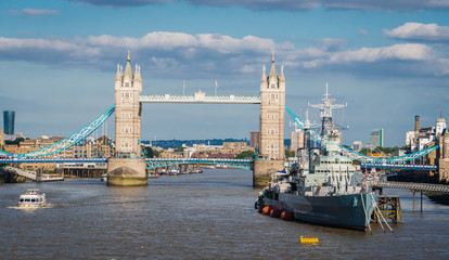 Fototapeta premium Tower Bridge in London with a battle ship with river Thame.