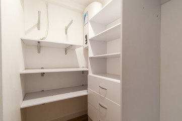 Russia, Moscow- June 15, 2018: interior room apartment. standard repair decoration in hostel. dressing room, hangers, storage system