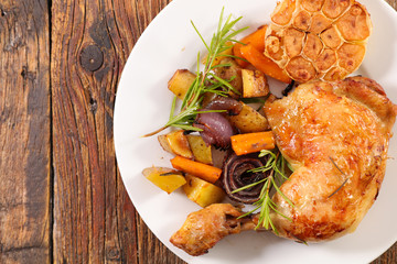 chicken leg with roasted vegetable and rosemary