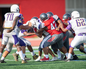 Great action photos of high school football players making amazing plays during a football game