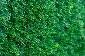 Side view of artificial grass wall, Green texture background.
