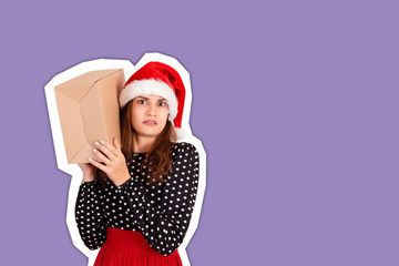 alarmed girl with her gift listens to what's in the box. Magazine collage style with trendy color background. holidays concept