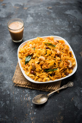 Cornflake Chivda or Corn Chiwda loaded with peanuts and Cashew. Served in a bowl. selective focus