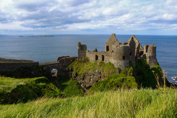 Fototapeta na wymiar Dunluce Castle on the cliff, Antrim, Causeway Coastal Route, Northern Ireland