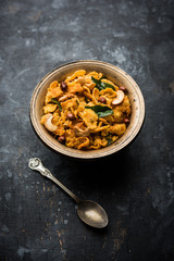 Cornflake Chivda or Corn Chiwda loaded with peanuts and Cashew. Served in a bowl. selective focus