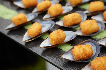 Fried mussels. Party appetizers