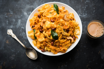 Cornflake Chivda or Corn Chiwda loaded with peanuts and Cashew. Served in a bowl. selective focus