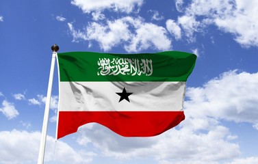 Flag of Somaliland, fluttering under a blue sky. Horn region of Africa is a state not recognized internationally. Motto: 
