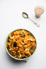 Cornflake Chivda or Corn Chiwda loaded with peanuts and Cashew. Served in a bowl. selective focus