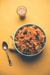 Cornflake Chivda or Corn Chiwda loaded with peanuts and Cashew. Served in a bowl. selective focus