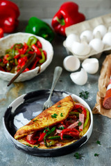 Omelet with pepper and salami.style rustic