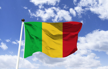 Mockup of Mali flag fluttering under blue sky. African country with no outlet to the western sea. Seventh largest in Africa. Capital of Bamako. Almost half of the population lives below the poverty li
