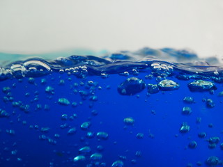 Naklejka na ściany i meble closeup blue water background, ink water color