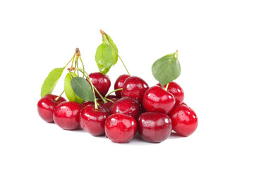 Sweet cherries with green leafs isolated on white background