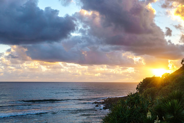 Fototapeta na wymiar Beautiful wide panoramic view of crushing ocean waves during stunning sunrise, visible from the park at Burleigh Heads, Queensland, Australia.