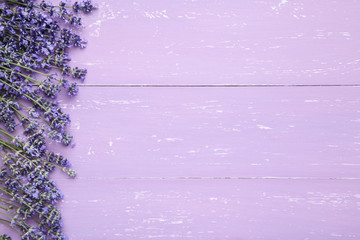 Lavender flowers on purple wooden table