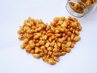 Peanuts in caramel isolated on white background