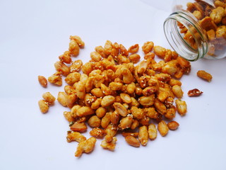 Peanuts in caramel isolated on white background