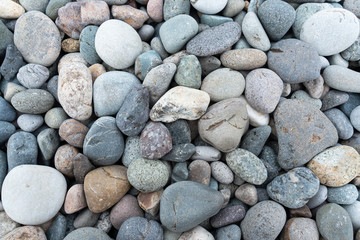 beautiful textured background and sea pebble stones closeup.