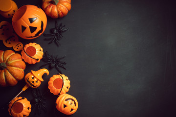 horror spooky funny ghost in halloween pumpkin holiday season greeting night celebration party with toy prop decoration in top view flatlay and trick of treat festival concept