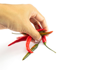 Red chillies, green chillies in female hands isolated on a white background