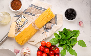 Ingredients for Italian Spaghetti Pasta. Raw materials for making pasta on a light background top view