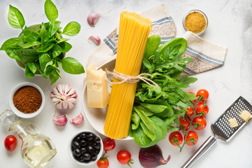 Ingredients for Italian Spaghetti Pasta. Raw materials for making pasta on a light background top view