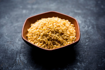 Salty and Fried Moong Dal Namkeen served in a bowl, selective focus