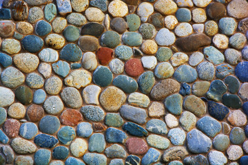 the wall is made of colored stones