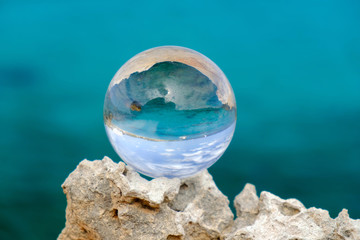 Crystal ball on the rock.