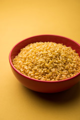 Salty and Fried Moong Dal Namkeen served in a bowl, selective focus