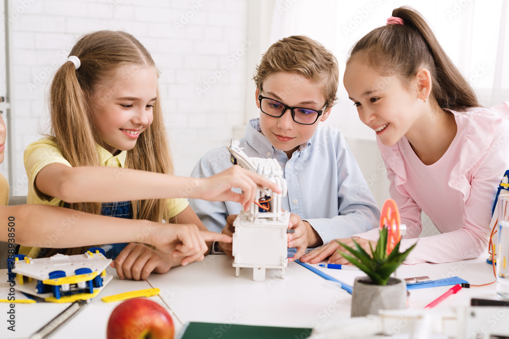 Aufkleber school pupils creating modern robots at stem class