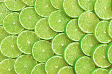 Fototapeta na wymiar Fresh lime slices as a background.