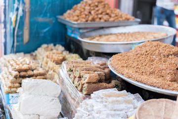 Selling cakes on the street market © focusandblur