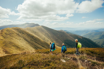 Family, dad and children go camping in the mountains