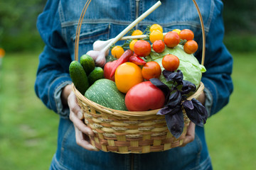 man holds basket with vegetables