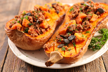 baked pumpkin with beef, sauce and grain