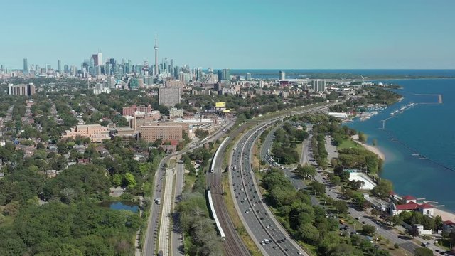 Aerial Establishing Shot of the Gardiner Expressway Leading into Downtown Toronto. Cinematic 4K Footage.