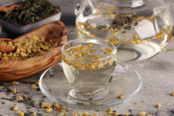 tea with Chamomile, sage and stinging nettle tea. Dried chamomile tea on table