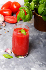 Tasty tomato juice with fresh spices, garlic, pepperr and basil