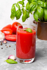 Tasty tomato juice with fresh spices, garlic, pepperr and basil