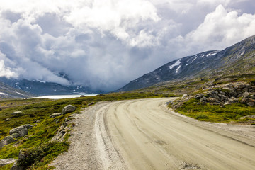 storm clouds over mountain road in Norway