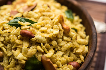 Jada Poha Namkeen Chivda / Thick Pohe Chiwda is a jar snack with a mix of sweet, salty and nuts flavours, served with tea. selective focus
