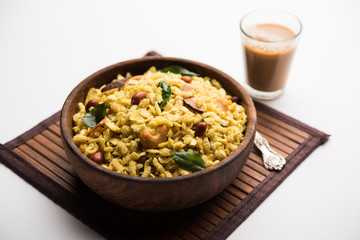 Jada Poha Namkeen Chivda / Thick Pohe Chiwda is a jar snack with a mix of sweet, salty and nuts flavours, served with tea. selective focus