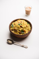 Jada Poha Namkeen Chivda / Thick Pohe Chiwda is a jar snack with a mix of sweet, salty and nuts flavours, served with tea. selective focus