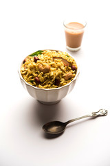 Jada Poha Namkeen Chivda / Thick Pohe Chiwda is a jar snack with a mix of sweet, salty and nuts flavours, served with tea. selective focus