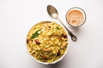 Jada Poha Namkeen Chivda / Thick Pohe Chiwda is a jar snack with a mix of sweet, salty and nuts flavours, served with tea. selective focus